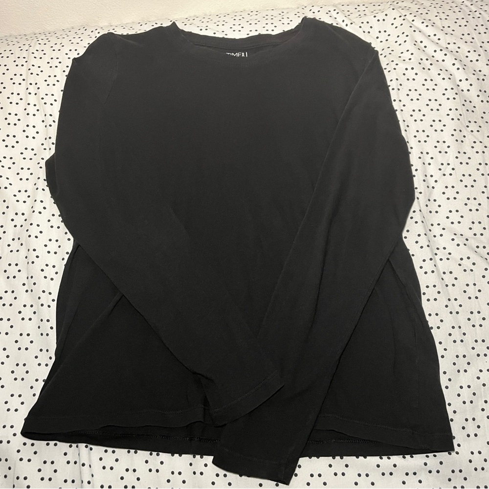 All black woman’s long sleeve shirt.